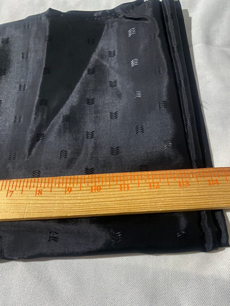 Black polyester lining fabric with small arrow embossed design 3 yards x 44″