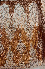 Orange sequin on stretch nude mesh fabirc 54” wide