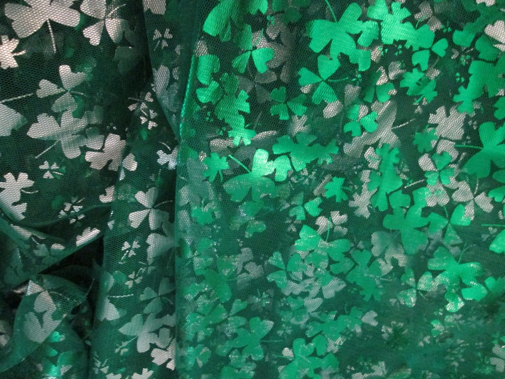 Green and Silver Sharmrock Print on Green Mesh Fabric 60 W x 2 yd AS IS Damaged