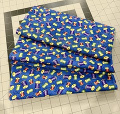 100% Cotton Colorful Thread Spools On Blue Background
