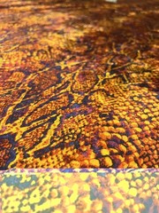 Fabric by the YARD orange, black and yellow snake skin ployester and elastane