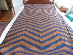 4411 ORANGE Machine Embroidered ZIGZAG DESIGN on NAVY COTTON FABRIC-48″x 4 yds.