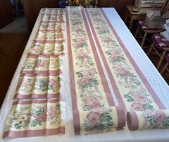 2 rolls ~150 total yds mauve cotton(?) 11″W floral border print fabric, +8 pcs