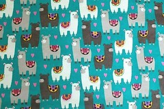 BTY*FACE MASK*WHITE/GREY LLAMAS WITH SADDLES ON TURQUOISE FLANNEL FABRIC 42X36″