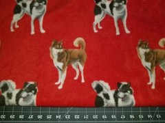 DOG PUPPY HUSKEY HUSKIES ON RED FLEECE FABRIC 1 YARD 36″ X 60″