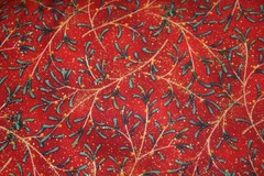 WINTER’S NIGHT-CHRISTMAS GREENERY ON RED FROM MAYWOOD – 100% COTTON FABRIC
