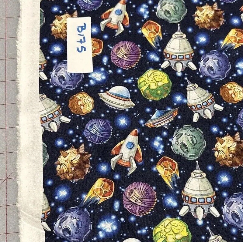 Novelty Rockets And Planets in blue space cotton Quilt Fabric By The Half Yard