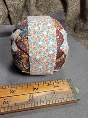 Handcrafted pieced fabric ball star pattern brown gold tones