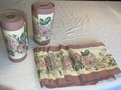 2 rolls ~150 total yds mauve cotton(?) 11″W floral border print fabric, +8 pcs