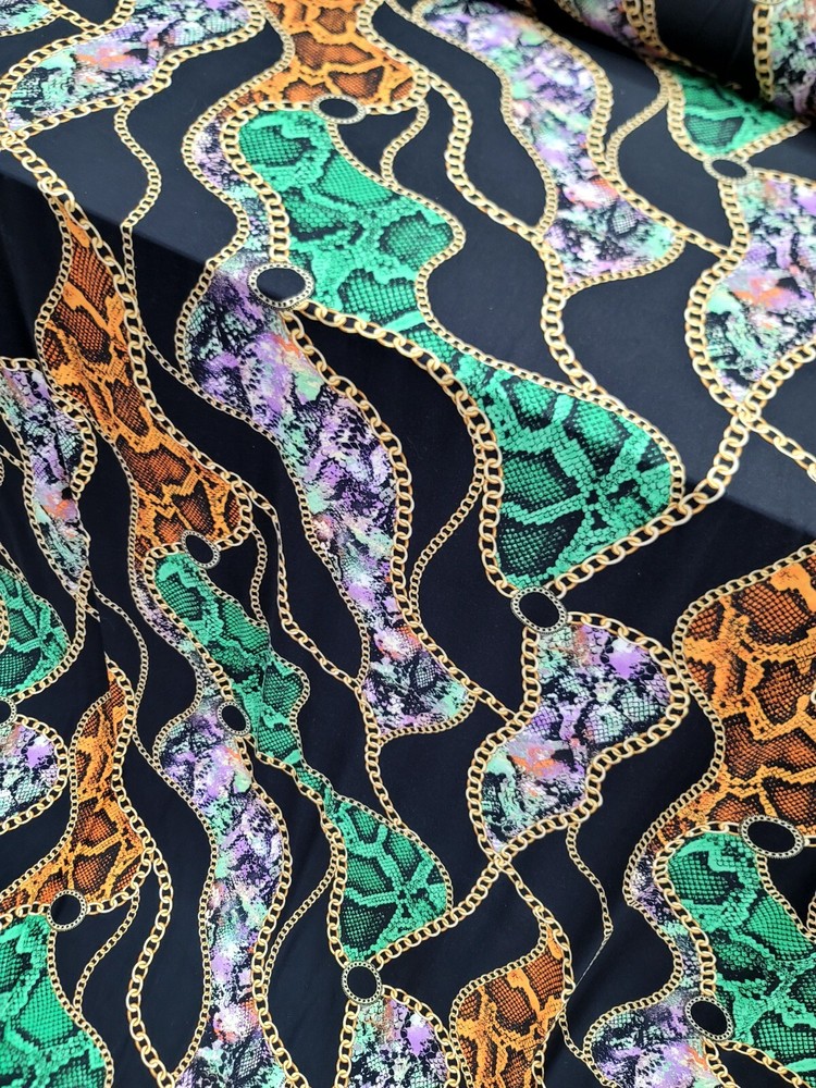 Snake print, Animal print, Jersey Knit Fabric. GREEN ORANGE STRETCH FABRIC Black