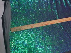 GREEN IRIDESCENT MINI SEQUINS EMBROIDER ON A BLACK MESH-FASHION-SOLD BY YARD.