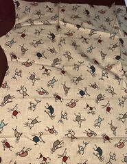 VTG Novelty Folk Art Kokopelli Figures Tossed on Beige Remnant 19″x14″ +