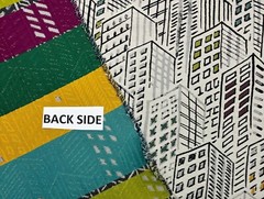 BRENTANO CITY SCAPE TURQUOISE CITY BUILDINGS UPHOLSTERY FABRIC BY YARD 54″W