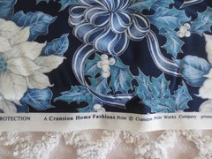 5055. VIP Cranston POINSETTIAS & BOWS on NAVY COTTON FABRIC – 43-1/2″ x 2 yds.