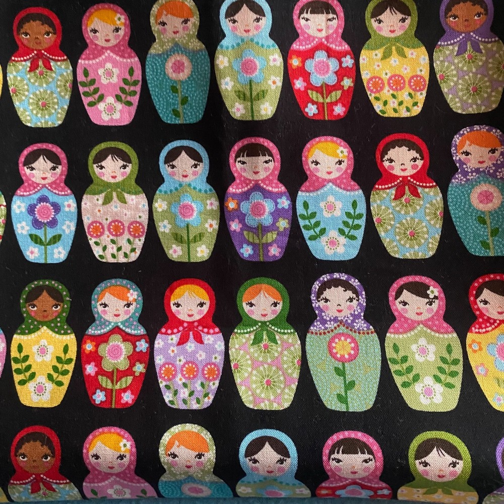 AEK Fabric “Matryoshka Dolls” #12197 18″X43″ Black with Colorful Nesting Dolls