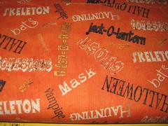 PRIMITIVE 100% HALLOWEEN SPOOKY SPECTACULAR WORDS ON ORANGE COTTON FABRIC 45″