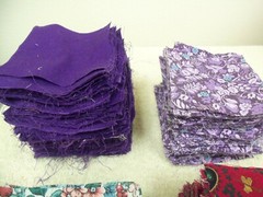l.12 LBS VINTAGE LOT VARIOUS FABRICS CUT INTO 3.5″ SQUARES – MOST PURPLE COLORS