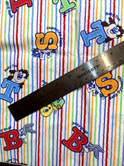 Tiny Toon Characters Alphabet Primary Colors on White 1Y Warner Brothers Fabric