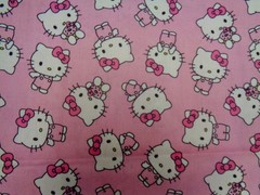 HELLO KITTY TOSSED DESIGN ON PINK BACKGROUND 100% COTTON 1/2 YARD PIECE