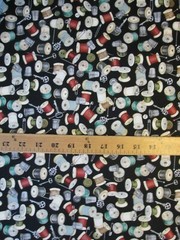 THREAD SPOOLS OF THIMBLE NEEDLES THREADER MORE ON BLACK COTTON FABRIC BTHY