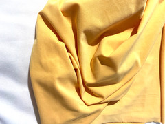 Solid yellow cotton,polyester,lycra blend fabric 32″x 60″ (4 way stretch)