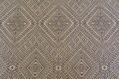 Geometric pattern woven upholstery decorator material in taupe and ecru