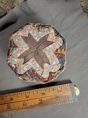Handcrafted pieced fabric ball star pattern brown gold tones