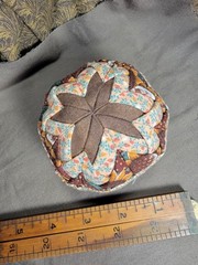 Handcrafted pieced fabric ball star pattern brown gold tones