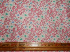 pink 1930s feed sack reproduction floral fabric Apron Strings Chloe’s Closet BTY