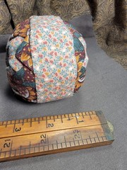 Handcrafted pieced fabric ball star pattern brown gold tones