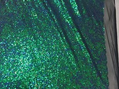 GREEN IRIDESCENT MINI SEQUINS EMBROIDER ON A BLACK MESH-FASHION-SOLD BY YARD.