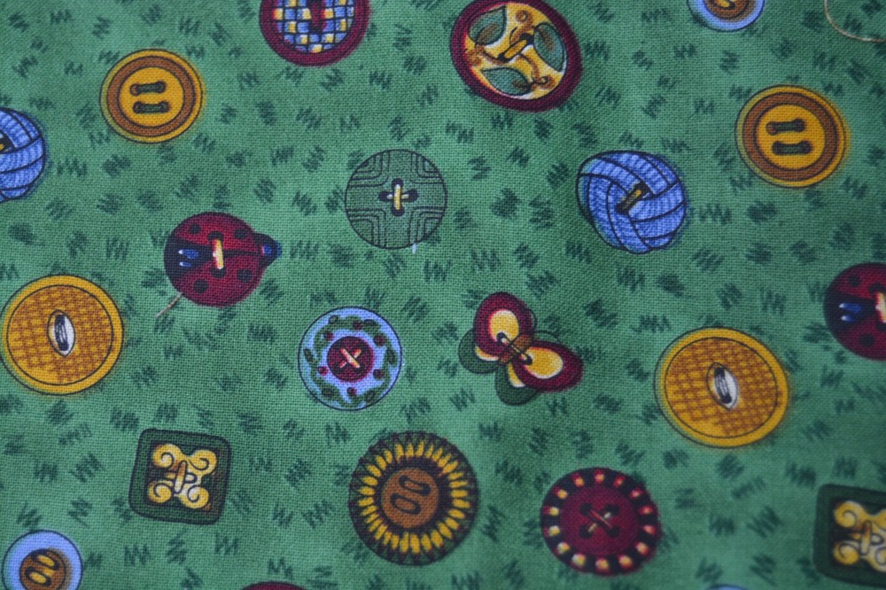 1.33 yards Debbie Mumm sewing buttons on green cotton 44″ wide