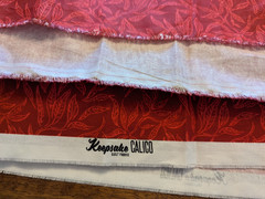 Keepsake Calico fabric – red leaves and branches – 45″x204″
