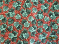 Garden Glory from Red Rooster Fabrics shades of teal leaves on brown background