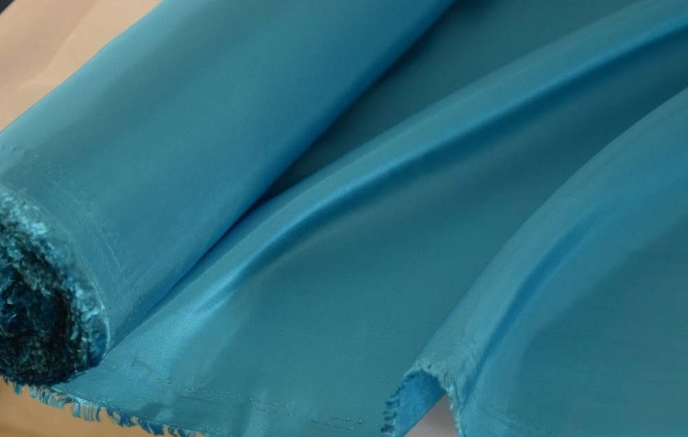 Turquoise Taffeta 100% Polyester 59/60″ wide by the yard or roll. Free swatches.