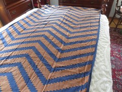4411 ORANGE Machine Embroidered ZIGZAG DESIGN on NAVY COTTON FABRIC-48″x 4 yds.