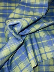 Blue/green plaid in medium weight looser weave synthetic fiber, 38″Lx54″W
