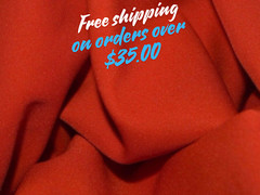 Orange Gabardine Tropical 100% Polyester non-stretch, machine washable.