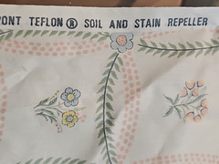 American legacy fabric beige polished cotton w/vines and small flowers 1981