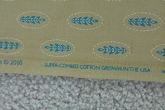 By 1/2 Yd, Blue Leaves on Tan Super-Combed-Cotton, Connecting Threads, V952