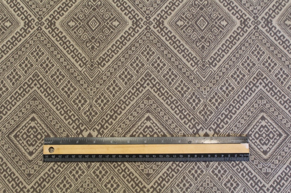 Geometric pattern woven upholstery decorator material in taupe and ecru