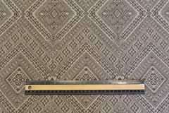 Geometric pattern woven upholstery decorator material in taupe and ecru