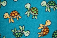 BTY*GOLD & GREEN BABY TURTLES SWIMMING ON TURQUOISE FLEECE FABRIC 1 YD 60X36″