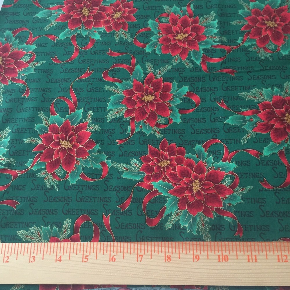 Seasons Greetings cotton poinsettia print fabric with gold metallic 36″ x 44″