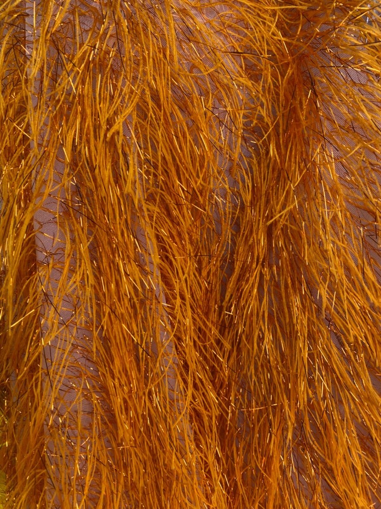 Orange Feather tinsel on mesh fabric per yard 60″ wide