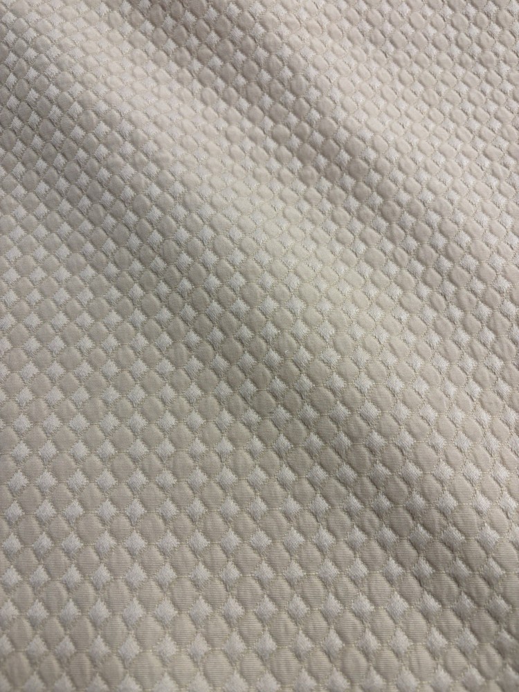 Goldfish Fabric Features A Distinct Embossed Geometric Medallion Pattern