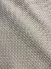 Goldfish Fabric Features A Distinct Embossed Geometric Medallion Pattern