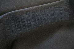 Tweed material by the metre or yard in plain black with Herringbone pattern
