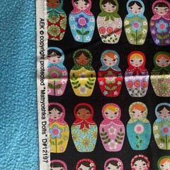 AEK Fabric “Matryoshka Dolls” #12197 18″X43″ Black with Colorful Nesting Dolls