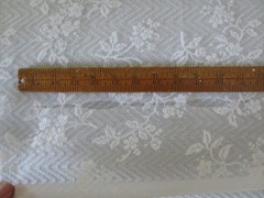 4613. WHITE FLORAL PATTERN LACE Polyester/Synthetic FABRIC – 54″ x 5 yds.
